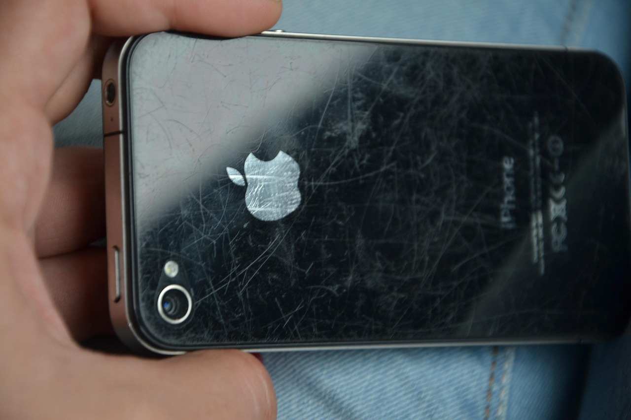 Heavily scratched but uncracked used iPhone back as an illustrative Grade C reference